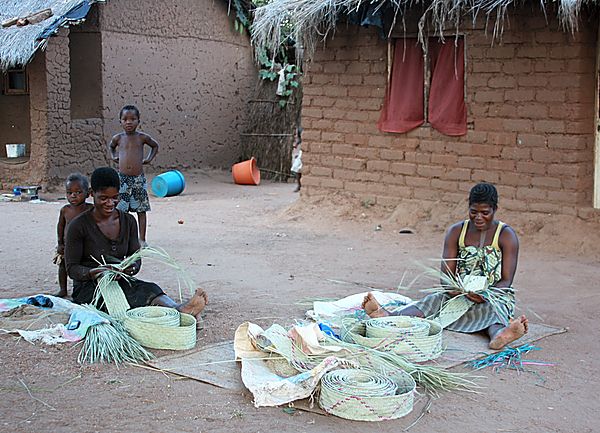 Ladies weaving mats and baskets