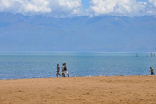 Friends On The Shore Of Lake Tanganyika, Mountains Of The Congo Behind